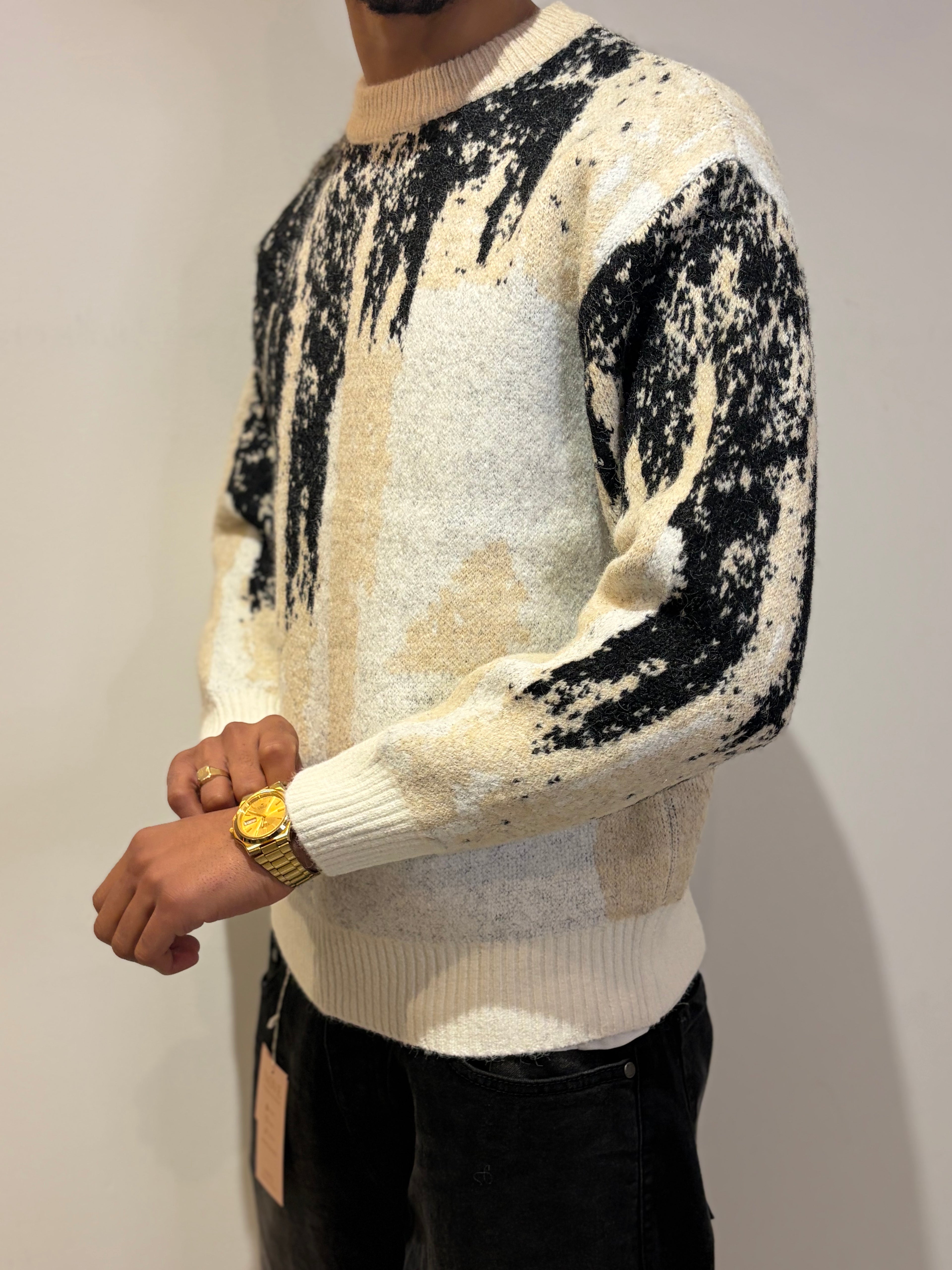 Pull au design abstrait noir et blanc